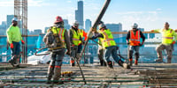Subcontractors pouring concrete safely being managed using HammerTech's subcontractor management software